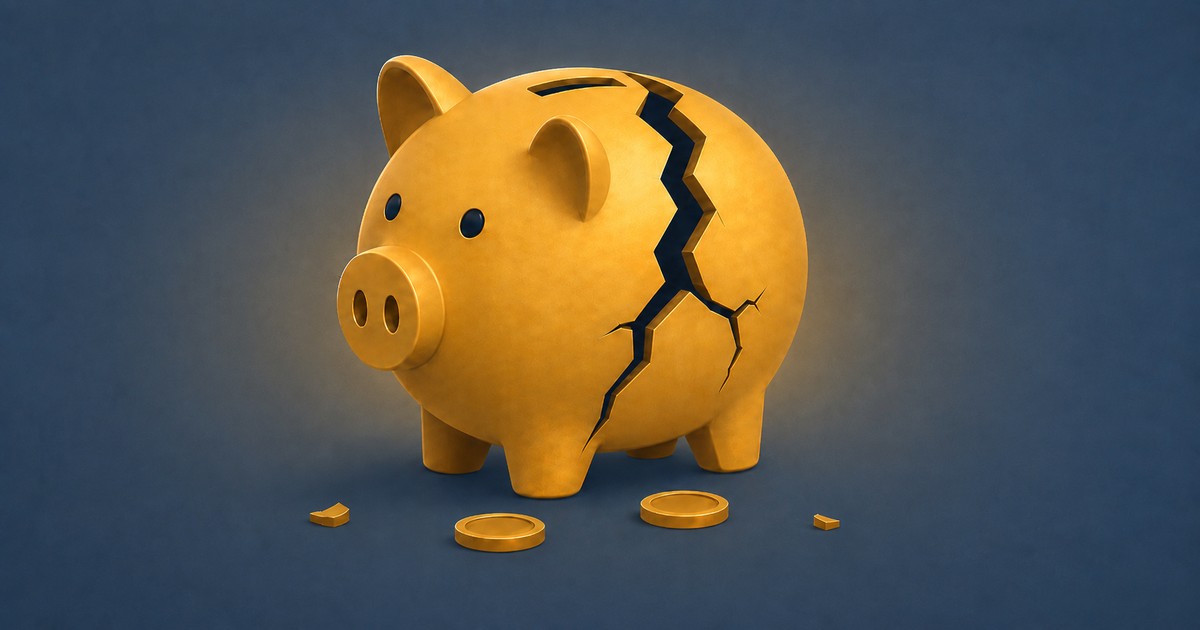A cracked piggy bank with coins spilling out.
